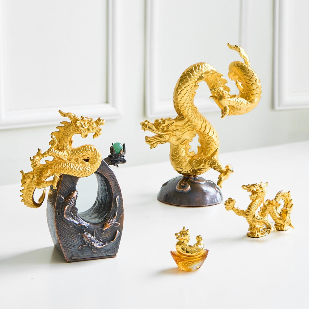 Risis Legend of XII - Dragon - Artistic golden and bronze dragons intricately designed with textured scales and fierce expressions, some perched atop oval stands, exhibit traditional stylization on a bright surface.