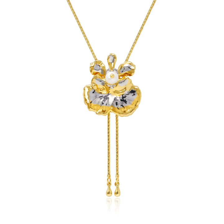 Risis Oncidium Coco Drop Pearl Slider Necklace (PG) - A golden-yellow flower pendant with silver-white accents, adorned by a central pearl, hangs from a chain, featuring delicate gold tassels beneath.