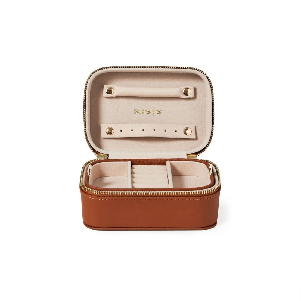 Risis Classic Jewellery Box - A rectangular brown jewelry box with a zipper, open to reveal a cream interior with slots for rings and a compartment for other trinkets.