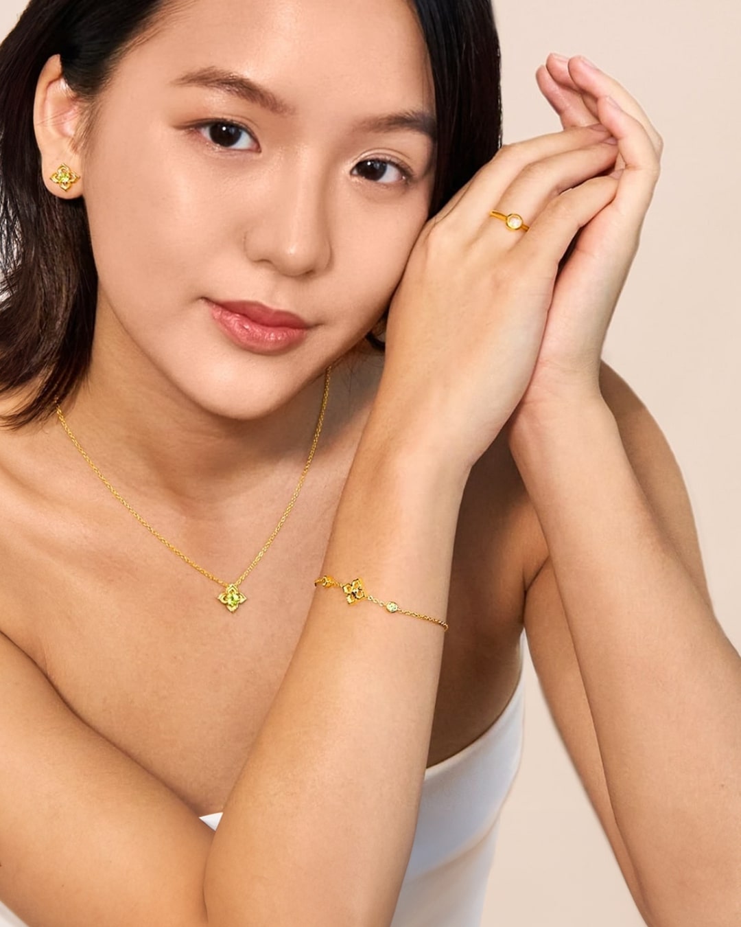 Featuring a model wearing RISIS 18K Gold Timeless Peranakan Jewellery Collection