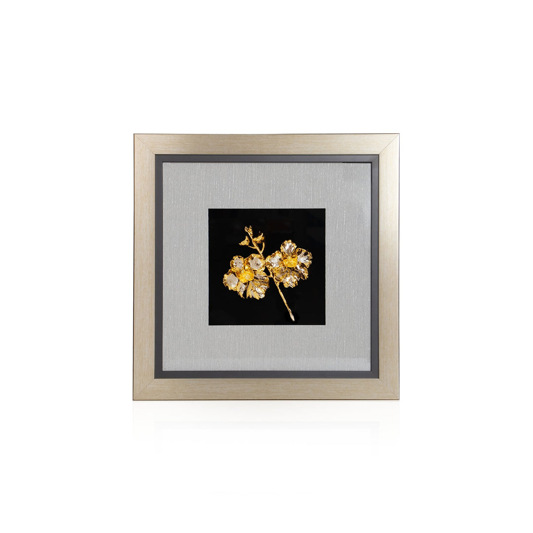 Risis Vanda Miss Joaquim Spray Orchid Frame Viii - A golden, intricate leaf brooch with sparkling details is showcased against a dark backdrop within a light-toned frame.