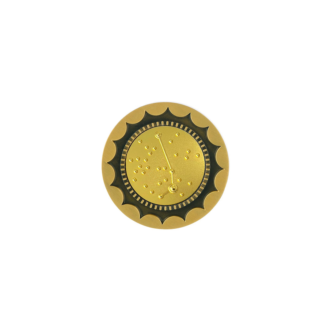 Risis 12 Constellation Base (Aries) - A golden, gear-like coin with an intricate, decorative center resembling a watch face, displaying embossed markings and raised dots.