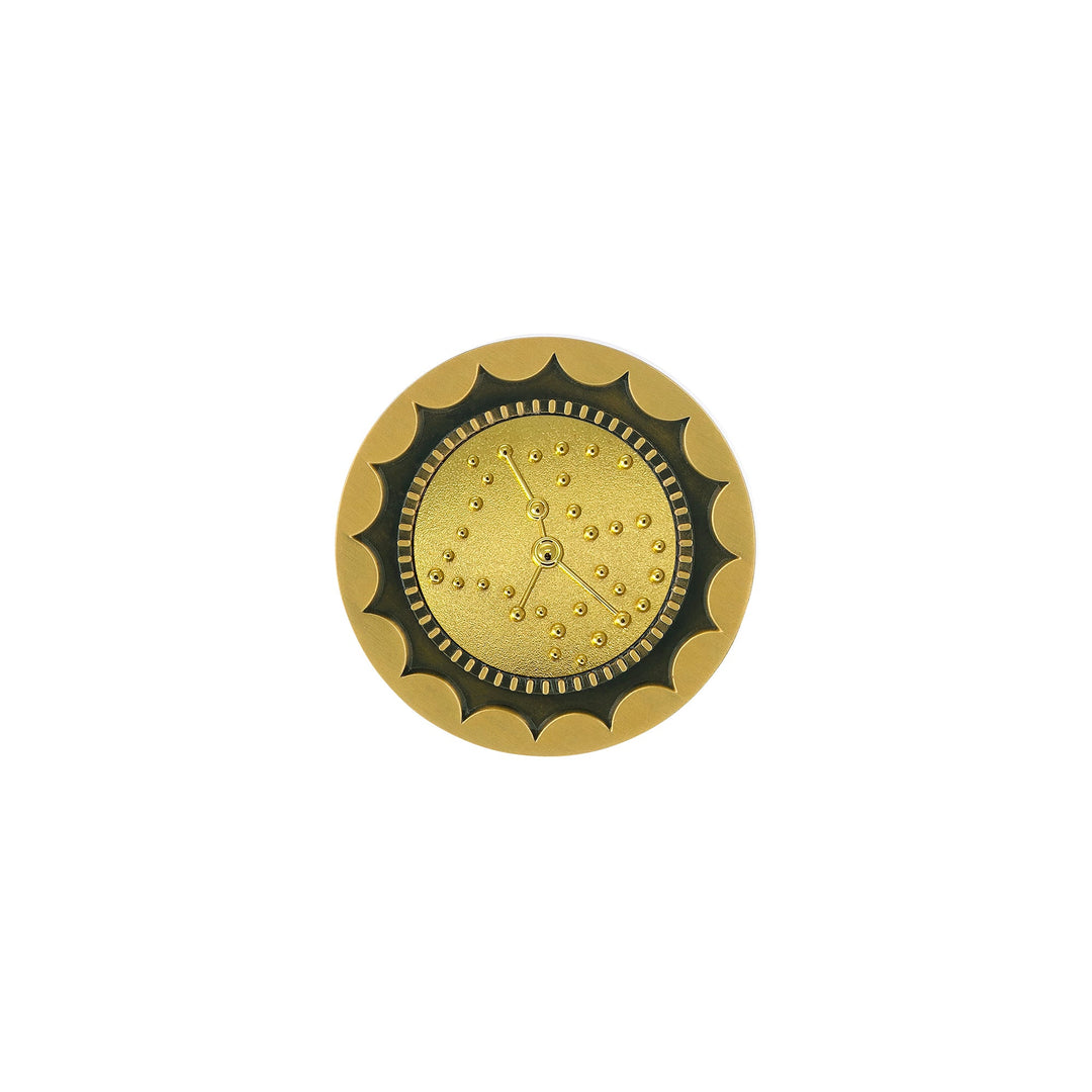 Risis 12 Constellation Base (Cancer) - A circular golden object with scalloped edges, a textured center, and a simple three-handed clock mechanism without numbers, exuding a decorative, vintage aesthetic.