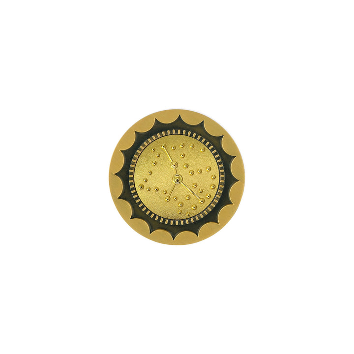 Risis 12 Constellation Base (Cancer) - A circular golden object with scalloped edges, a textured center, and a simple three-handed clock mechanism without numbers, exuding a decorative, vintage aesthetic.