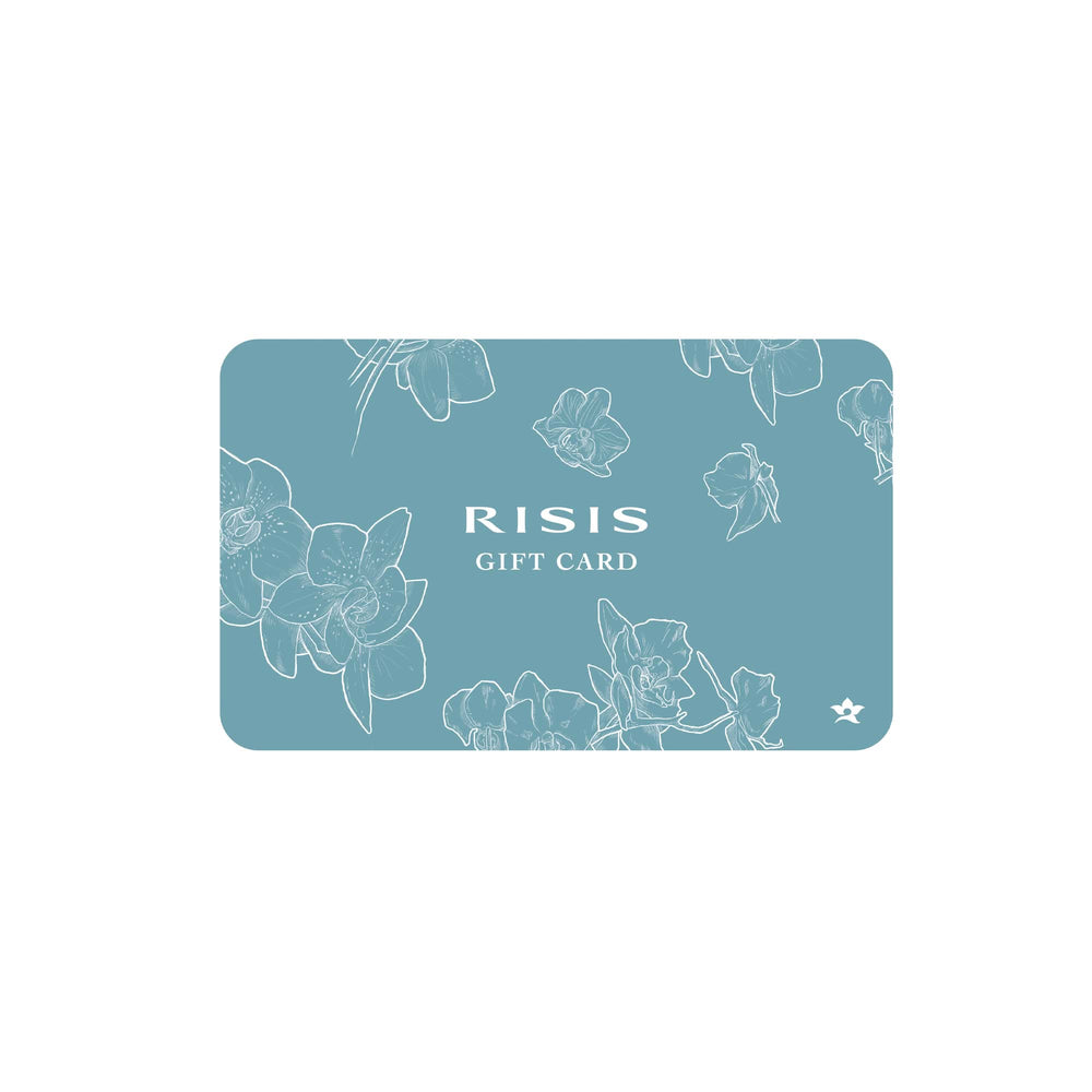 Risis - The image displays a rectangular gift card with a teal background adorned with delicate, white line-drawn orchids GIFT CARD" in clean white text.