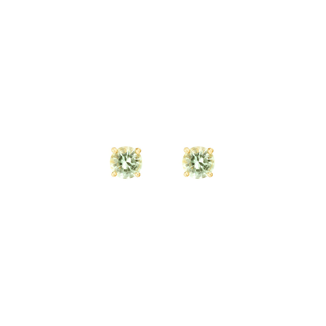 Risis Midori Earrings With Prasiolite - A pair of round-cut, light green gemstone earrings with a golden setting, reflecting light with a subtle sparkle.