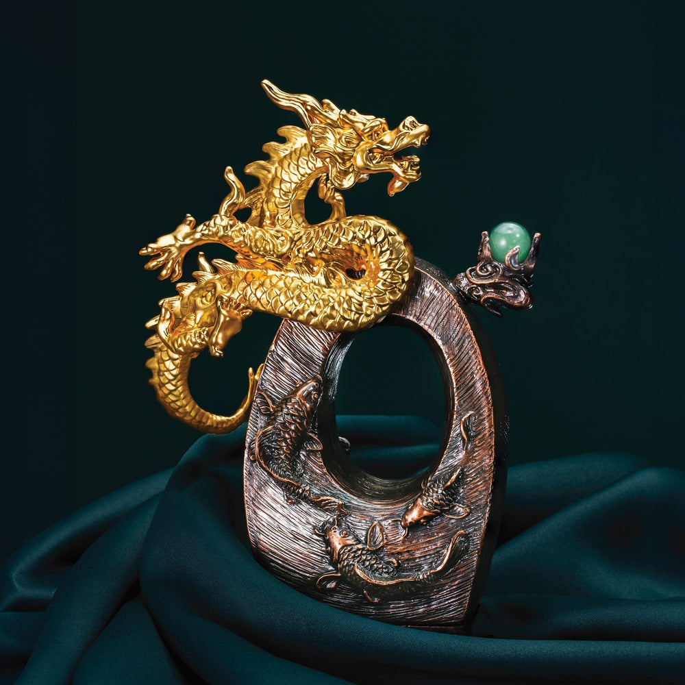 Risis Ascension Seal - A golden dragon with intricate scales and an animated posture is entwined around a textured, dark bronze circle, accompanied by a smaller dragon clutching a green orb.