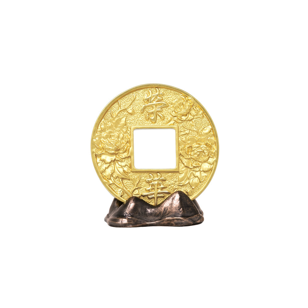 Risis Auspicious Coin on Mountain - A golden circular ornament with intricate floral patterns and Chinese characters, displayed on a dark, metallic stand.