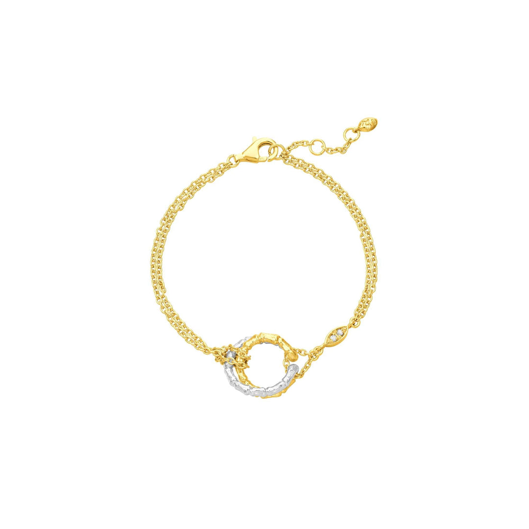 Risis Bamboo Twist Bracelet with White Sapphires - A delicate gold-tone bracelet features a textured chain with an integrated ring element adorned by a crystalline accent, presenting an elegant and refined appearance.