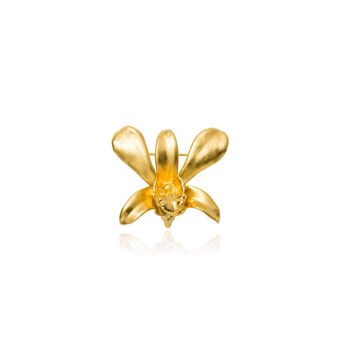 Risis Dendrobium Li Min Eng Orchid Brooch/Pendant (G) - A golden, orchid-shaped jewelry piece with smooth, reflective petals centered around a detailed core, exhibiting elegance and simplicity.