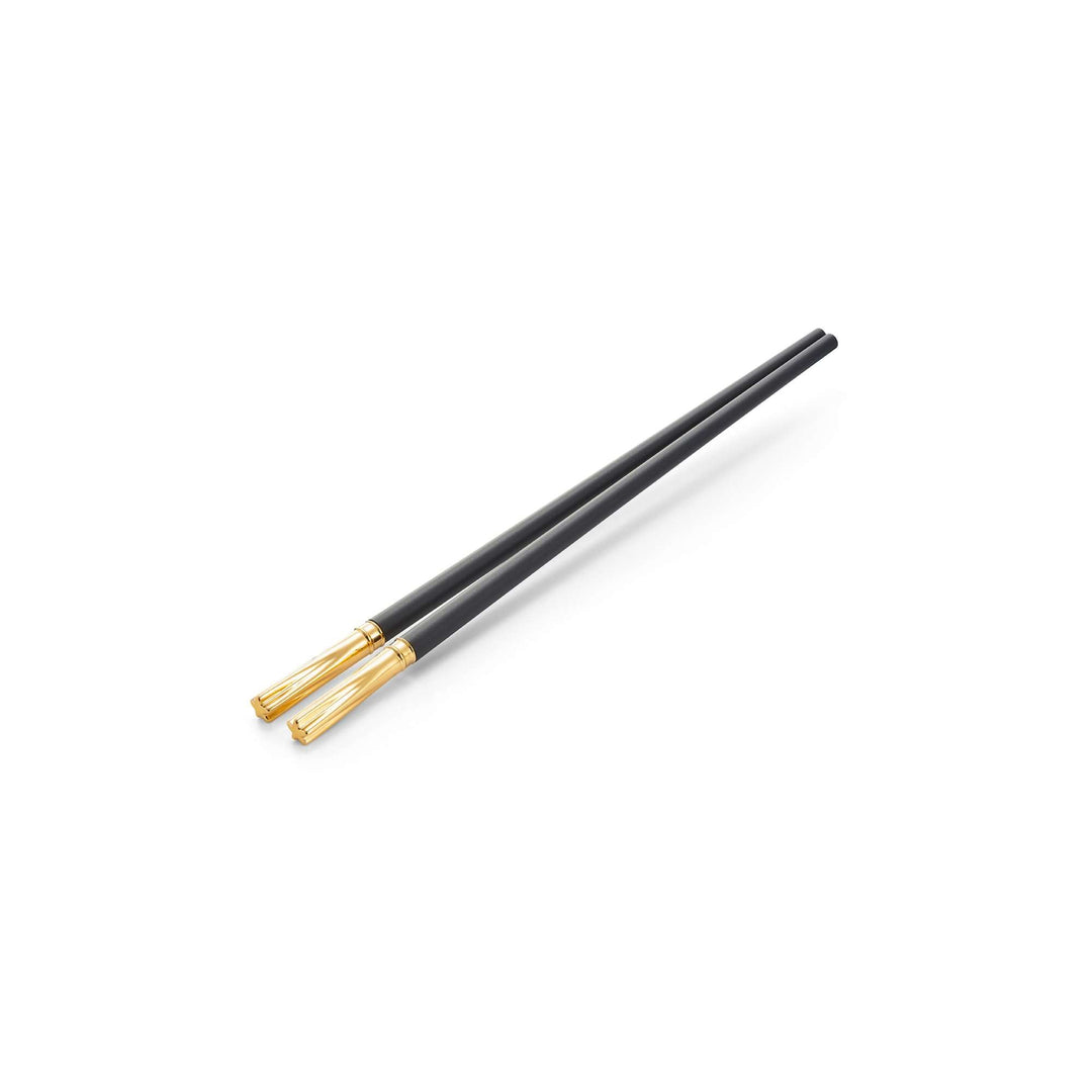 Risis Flower Chopsticks - A sleek black chopstick with elegant gold accents on the tapered end, exemplifying minimalist design and sophistication.