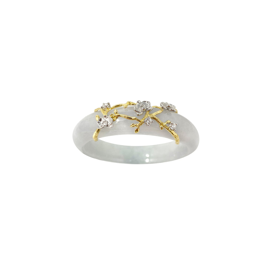 Risis Jadeite Bloom IV - A white jade bangle features a delicate gold branch overlay adorned with small diamond flowers. The design evokes natural elegance and subtle luxury.