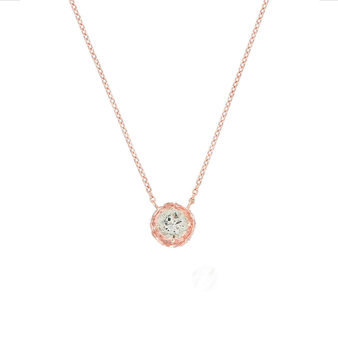 Risis Midori Necklace with Prasiolite (RG) - A woman showcases a sparkling green gemstone ring and matching earrings set in rose gold, with a focus on the jewelry's radiant elegance.