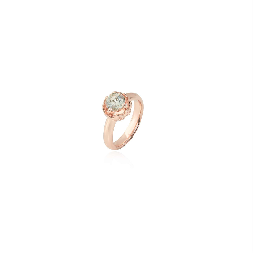 Risis Midori Ring with Prasiolite (RG) - A rose gold ring with a central, round-cut pale gemstone set in a intricately detailed mount, presented against a neutral backdrop.