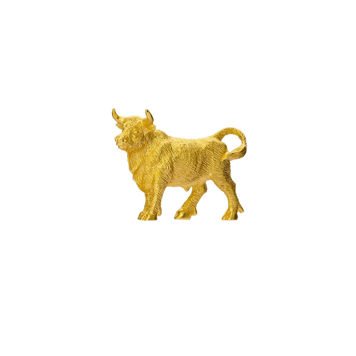 Risis Mini Orientals - Ox - A golden statue of a bull with textured fur detailing, standing with its head turned slightly to the left, exuding a feeling of strength and vitality.