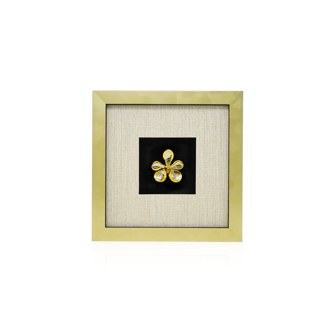 Risis Mokara Orchid Frame VII - A golden four-petaled flower with a glittering center sits centrally within a textured linen-hued mat, framed by a glossy golden border.