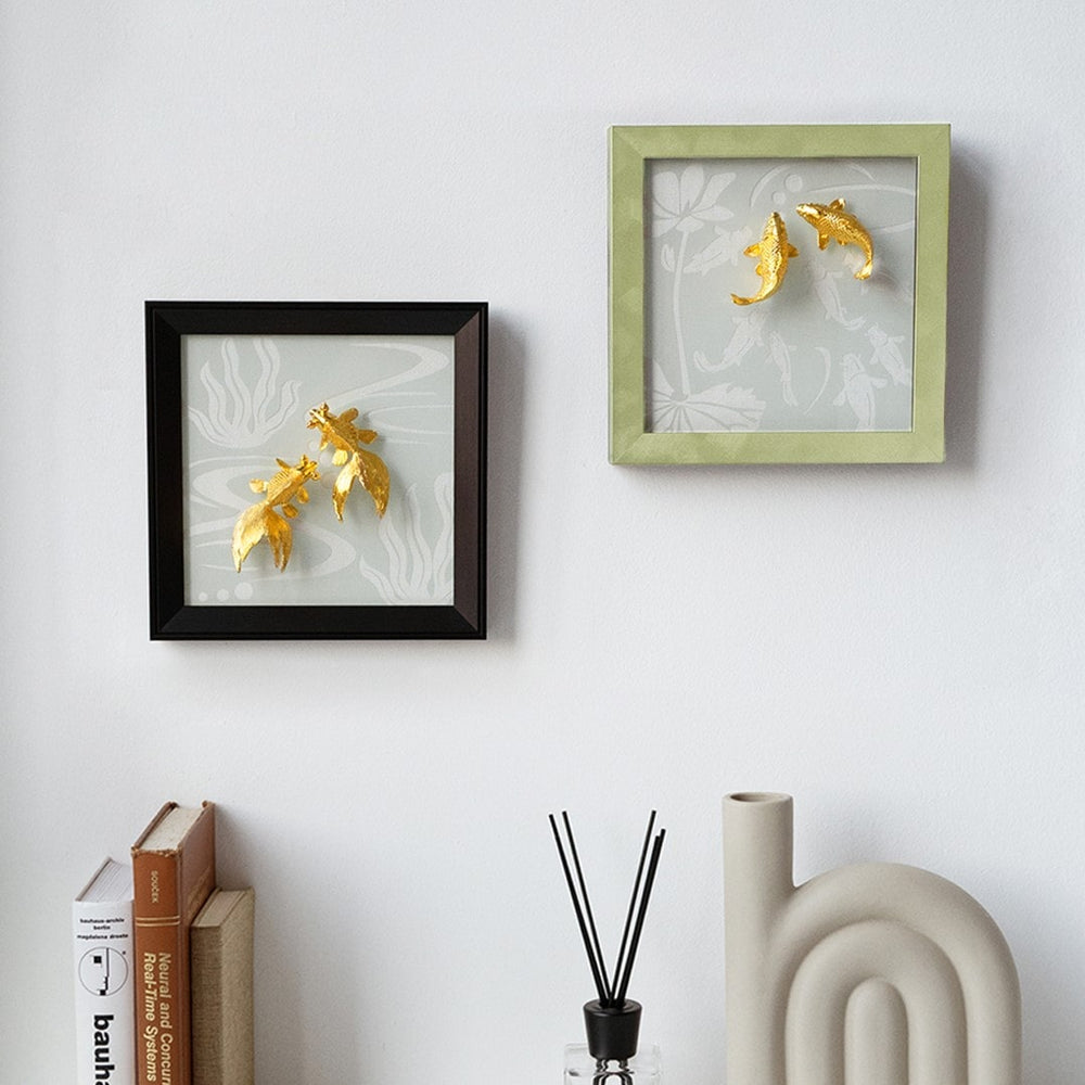 Risis Nine Carp On Frame IV - Two framed artistic decorations featuring elegant golden koi fish are mounted on a wall, exuding a sense of tranquility and beauty.