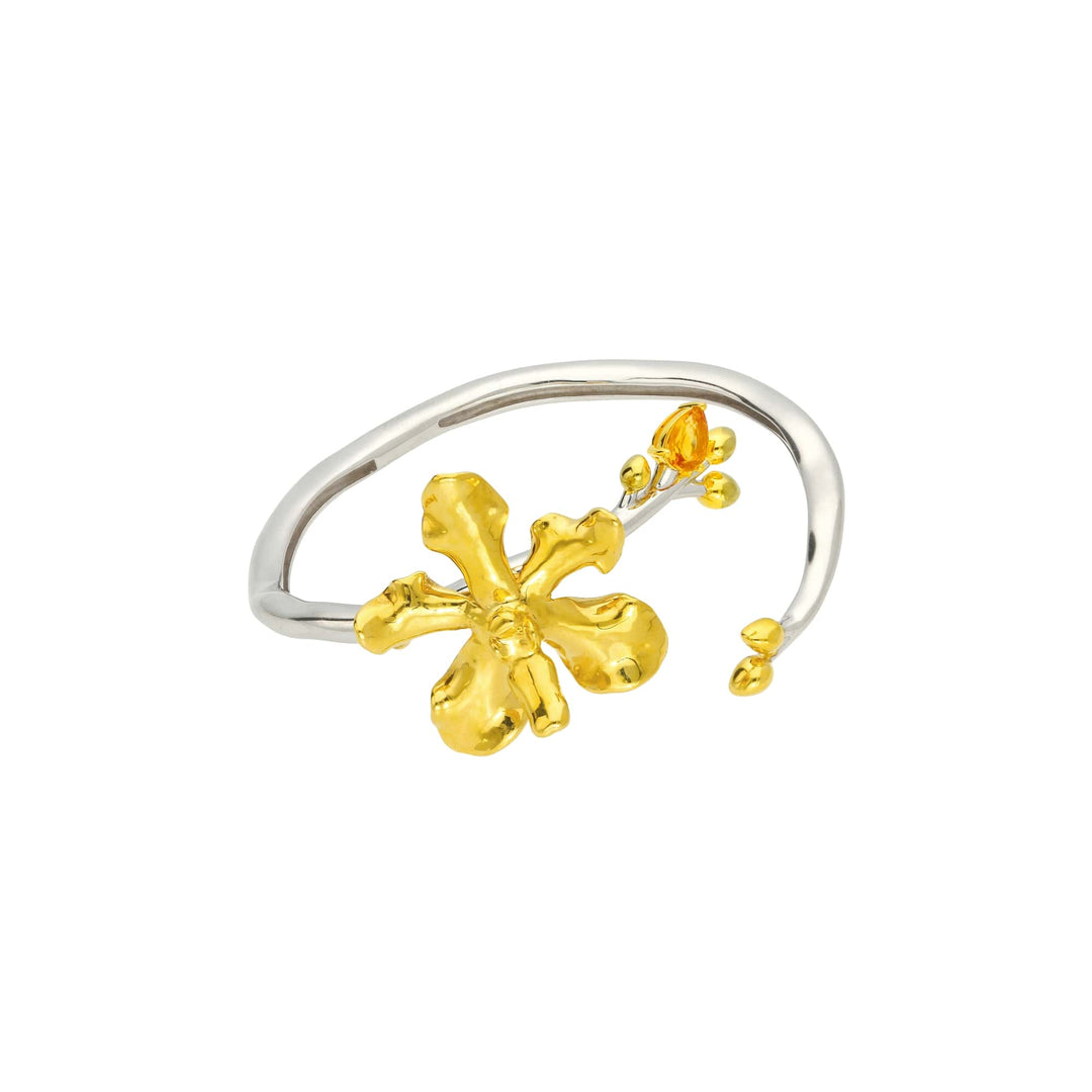 Risis Orchid Spiral Bangle - A silver and gold bracelet with a large, sculpted golden flower and a smaller golden accent with a teardrop-shaped adornment.