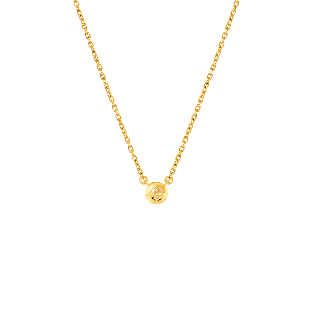 Risis Peranakan Jewel Necklace with Moonstone - A delicate gold necklace with a lustrous, simple, round pendant showcasing a cut-out geometric pattern, suspended centrally on a slender chain.