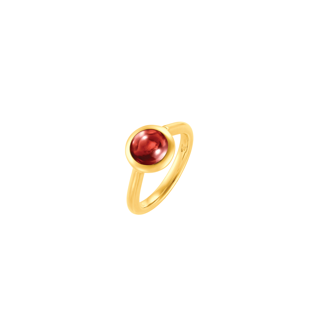 Risis Peranakan Jewel Ring with Red Garnet - A gold ring, earrings, and pendant featuring soft pink pearls exhibit understated elegance against a white fabric surface.