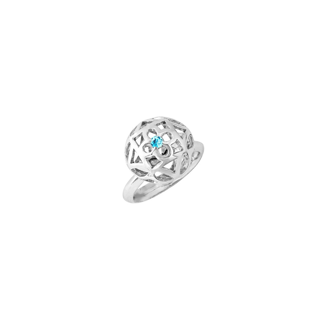 Risis Peranakan Spheres Large Ring with Blue Topaz (RH) - A silver ring with an intricate, geometric lattice design encases a small, centrally-set, sparkling blue gemstone.