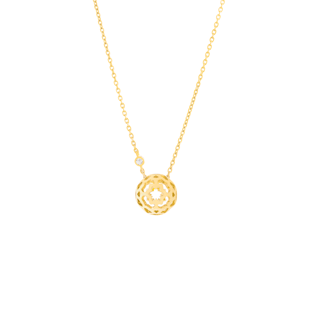 Risis Peranakan Spheres Small Necklace with White Topaz (G) - A golden necklace with a delicate, ornate spherical pendant and a single small diamond on the chain above it, showcasing intricate craftsmanship and elegance.