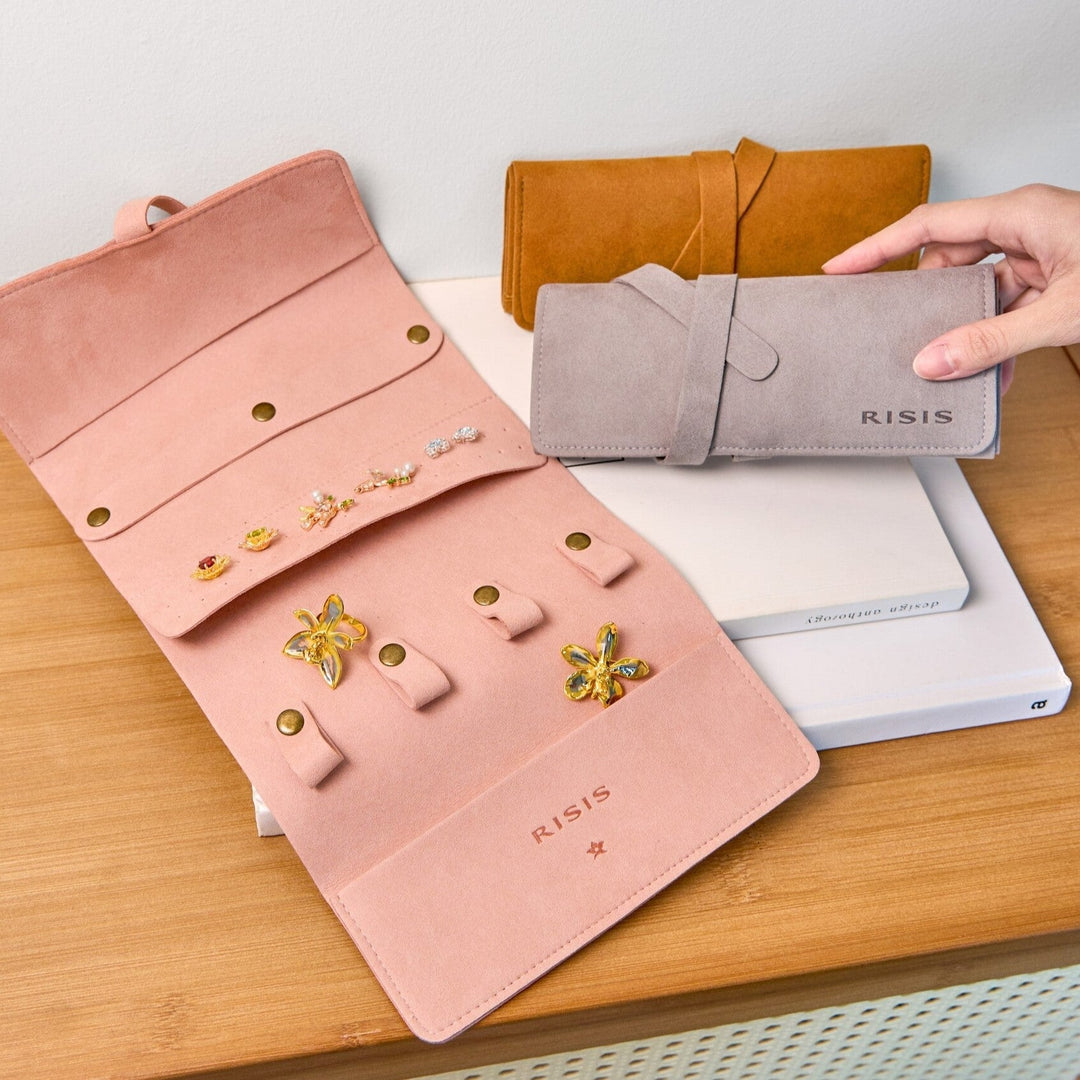 Risis Jewellery Travel Pouch - An illustration of a yellow orchid with green leaves, framed in brown on an off-white mat, exudes simplicity and elegance.