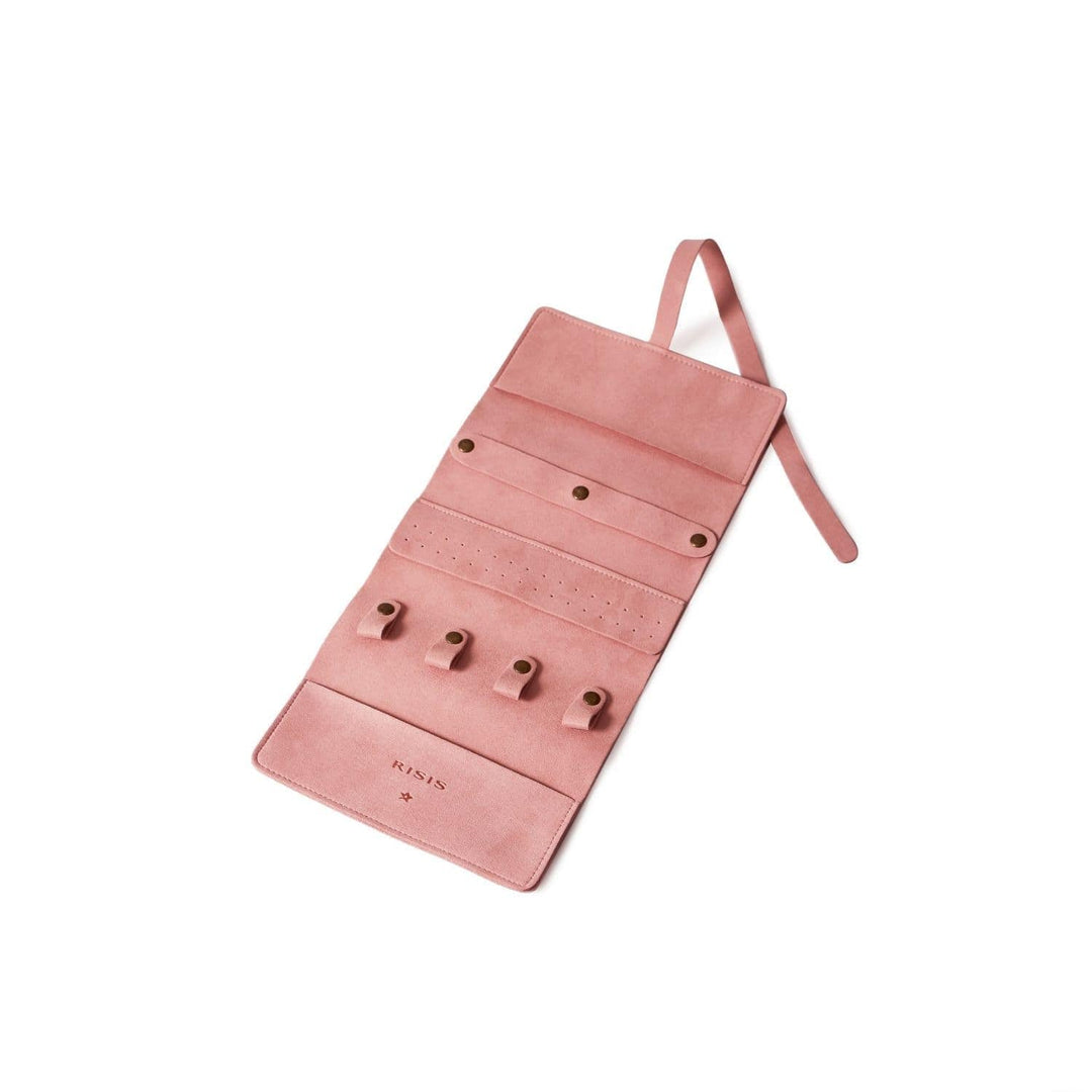 Risis Jewellery Travel Pouch - A blush pink jewelry roll with multiple straps and pouches to secure various pieces, featuring a suede-like texture and subtle stitching details.