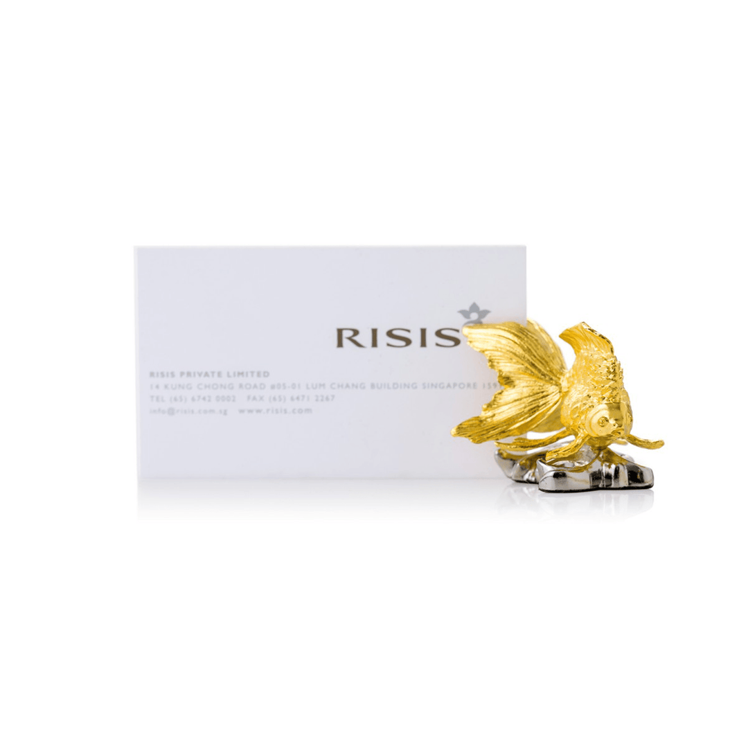 Risis Ryukin Goldfish Name Card Holder (Small) - A golden fish figurine with intricate detailing and metallic sheen, displayed in front of a white card with black text.