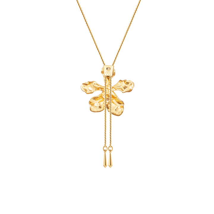 Risis Vanda Wee Kim Lian Orchid Slider Necklace (PG) - A golden pendant shaped like a four-leaf clover with a lustrous finish, highlighted by a small gemstone and delicate chains with miniature bar drops.