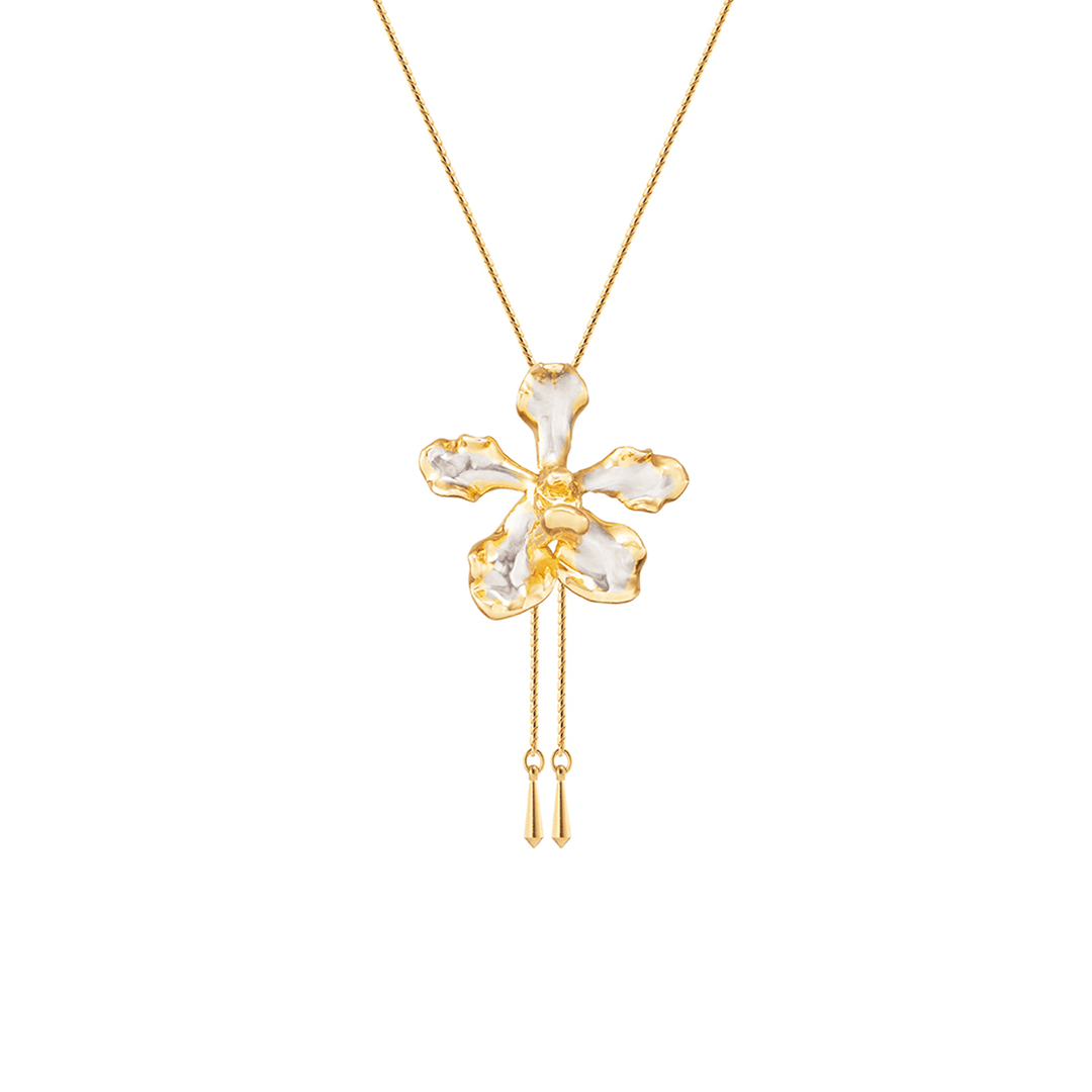 Risis Vanda Wee Kim Lian Orchid Slider Necklace (PG) - A gold chain necklace with an ornate, flower-shaped pendant featuring glossy, irregular gold edges and pearl-like inlays, accented by two dangling gold pieces.