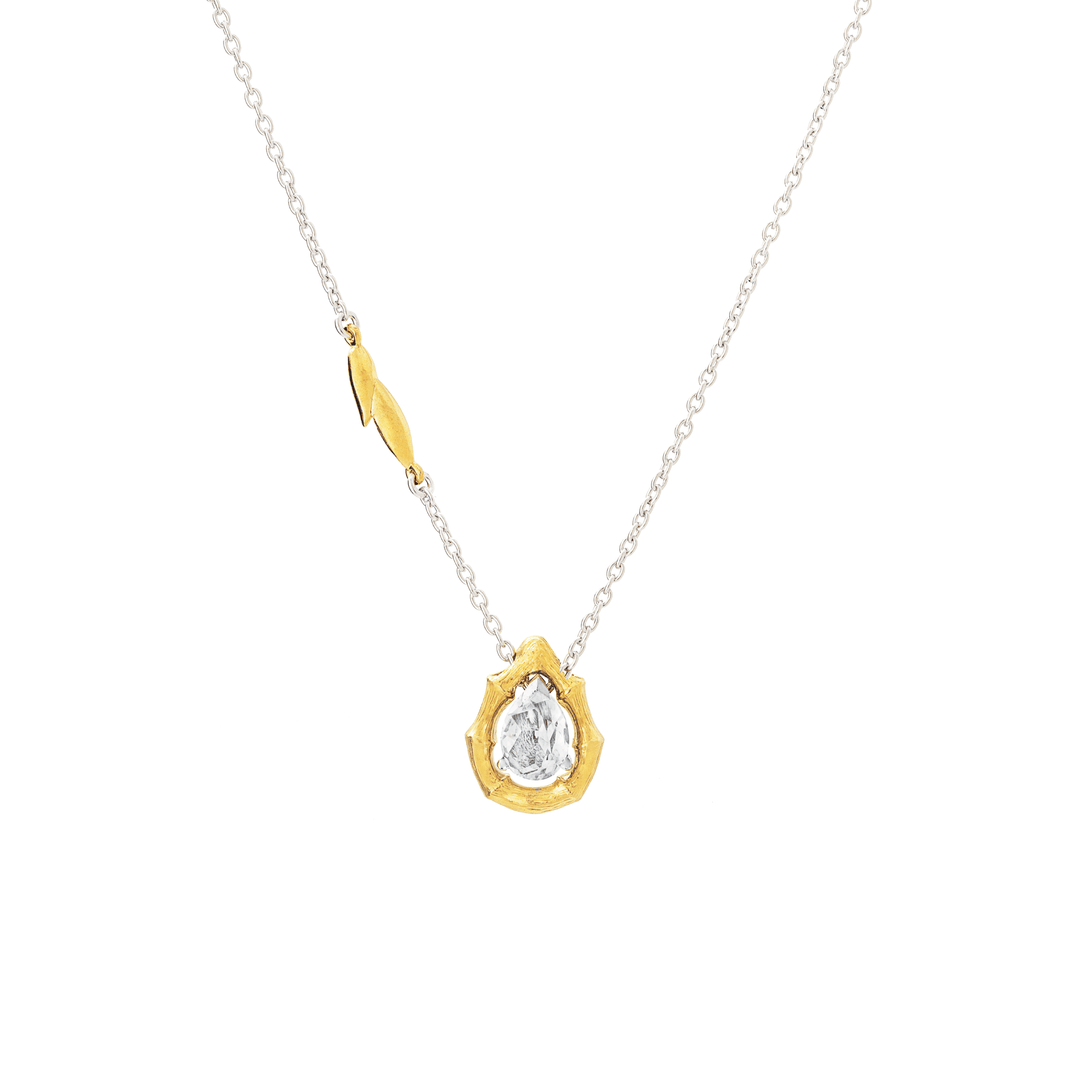Risis Vintage Bamboo Necklace with White Topaz - A silver chain necklace with a gold accent, carrying a pendant with a textured gold border and a sparkling central gemstone.