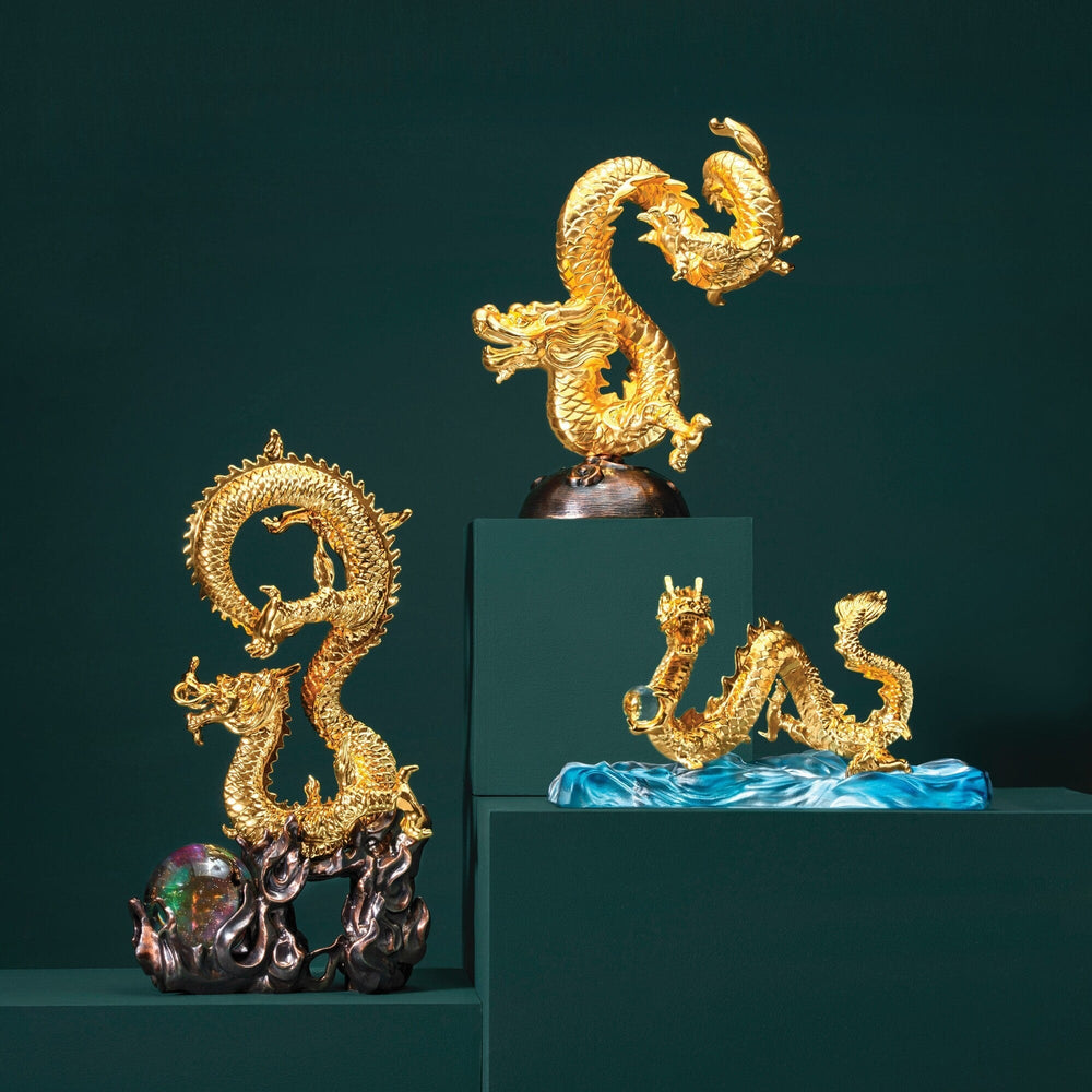 Risis Wealth Dragon - Three golden dragons with intricate details are displayed, each posed differently atop dark-toned stands, exuding elegance and mythical grandeur.