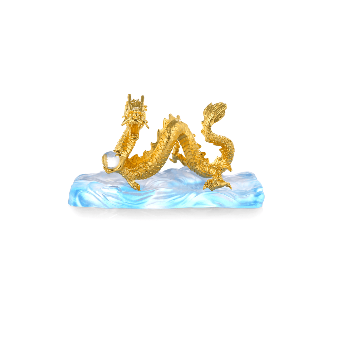 Risis Wealth Dragon - A golden dragon with intricate scales and horns arches gracefully above a shimmering blue and white wave, clutching a transparent orb.